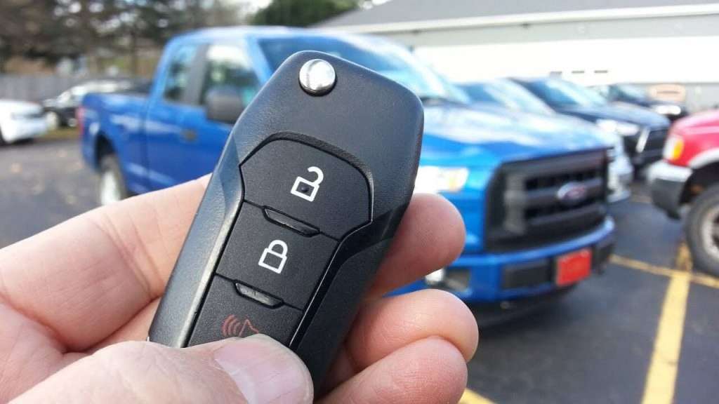 Auto locksmith diagnosing and replacing a VW BMW Ford car key in Nottingham